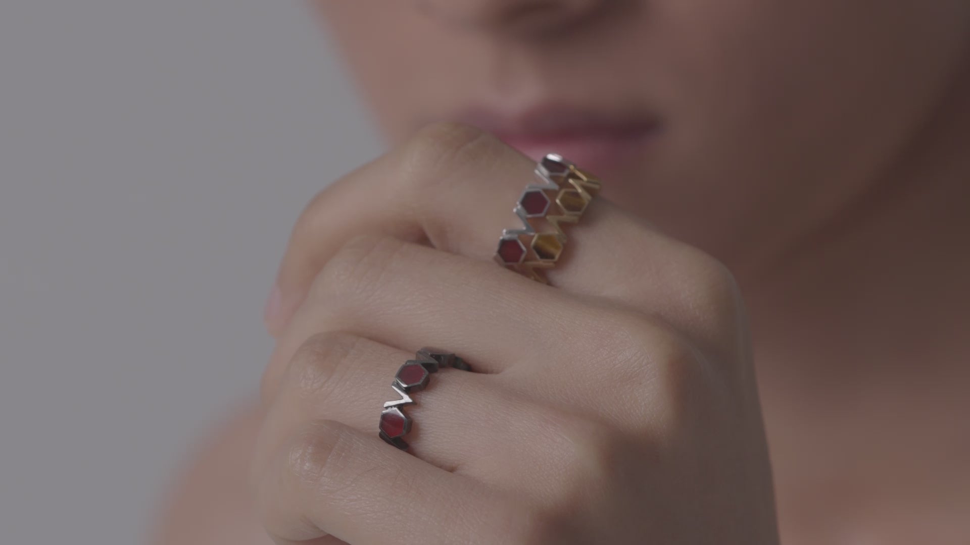 Man models multiple Castle bands with various gemstones